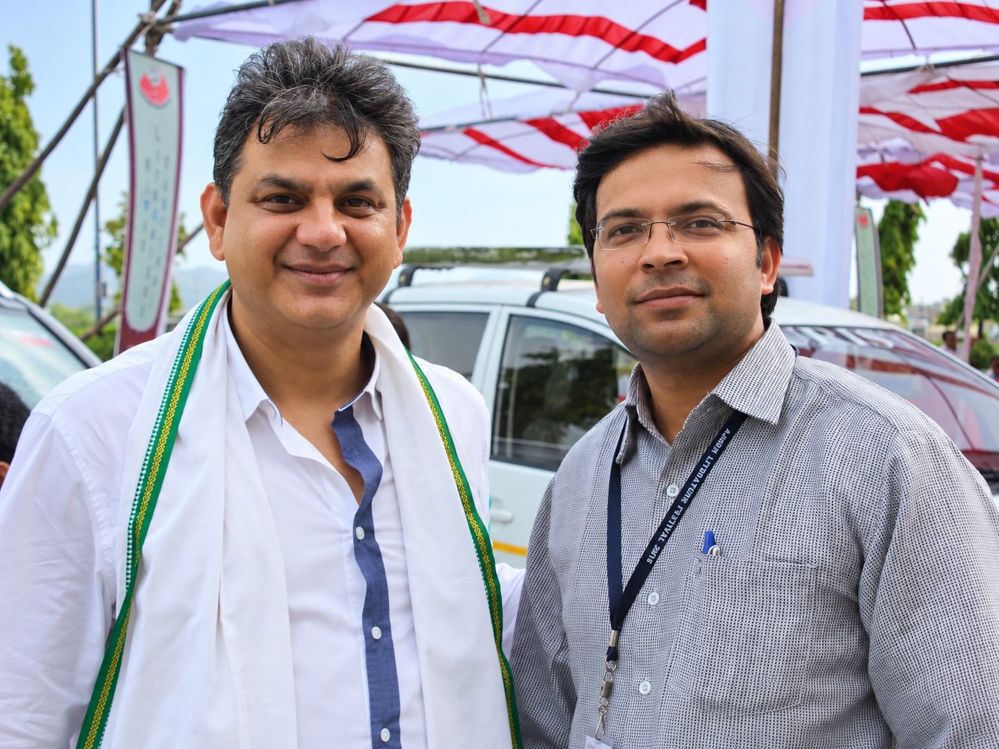 Two attendees at an outdoor event